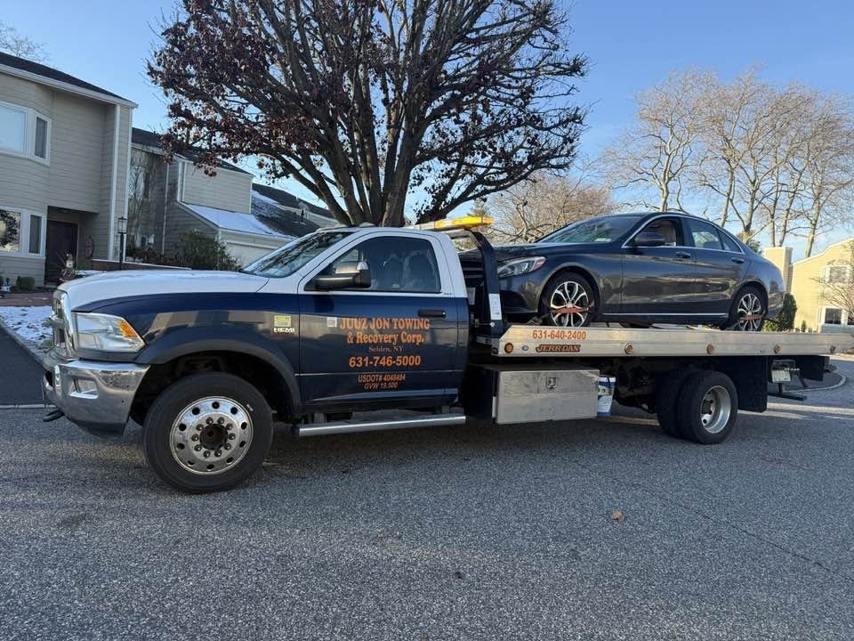 Sedan Transport by Juuz Jon Towing Recovery Corp
